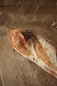Baguette is a classic French tradition, known for its crisp crust and airy crumb. Made using a long-fermented method, it develops deep flavor and perfect texture — perfect with butter, cheese, or simply dipped in olive oil.