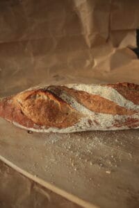 Baguette is a classic French tradition, known for its crisp crust and airy crumb. Made using a long-fermented method, it develops deep flavor and perfect texture — perfect with butter, cheese, or simply dipped in olive oil.